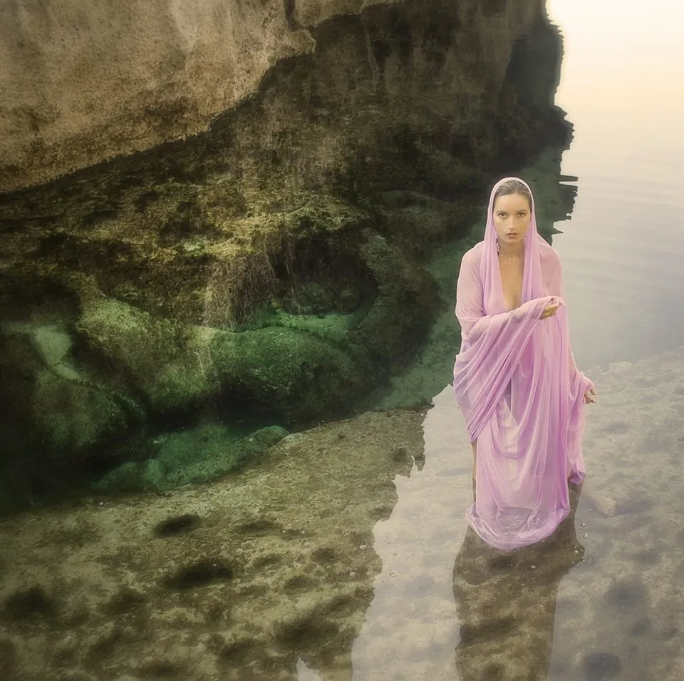 Camille Lutrat Vidacek, founder of Believe, beneath a pink veil