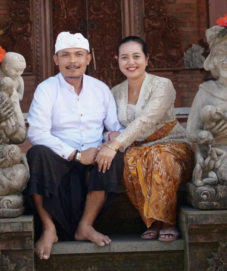 Atu Aji and Abhyudaya, Balinese healers in traditional dress in front of a temple in Bali