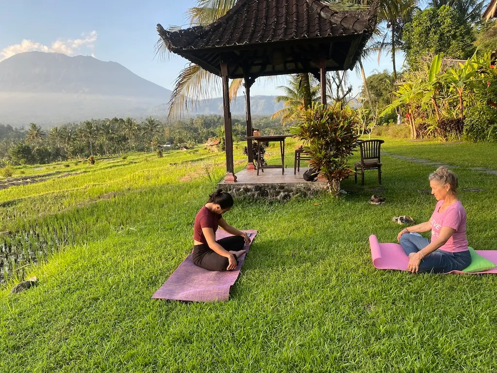 Yoga practice at daybreak facing the volcano, tailor-made retreat